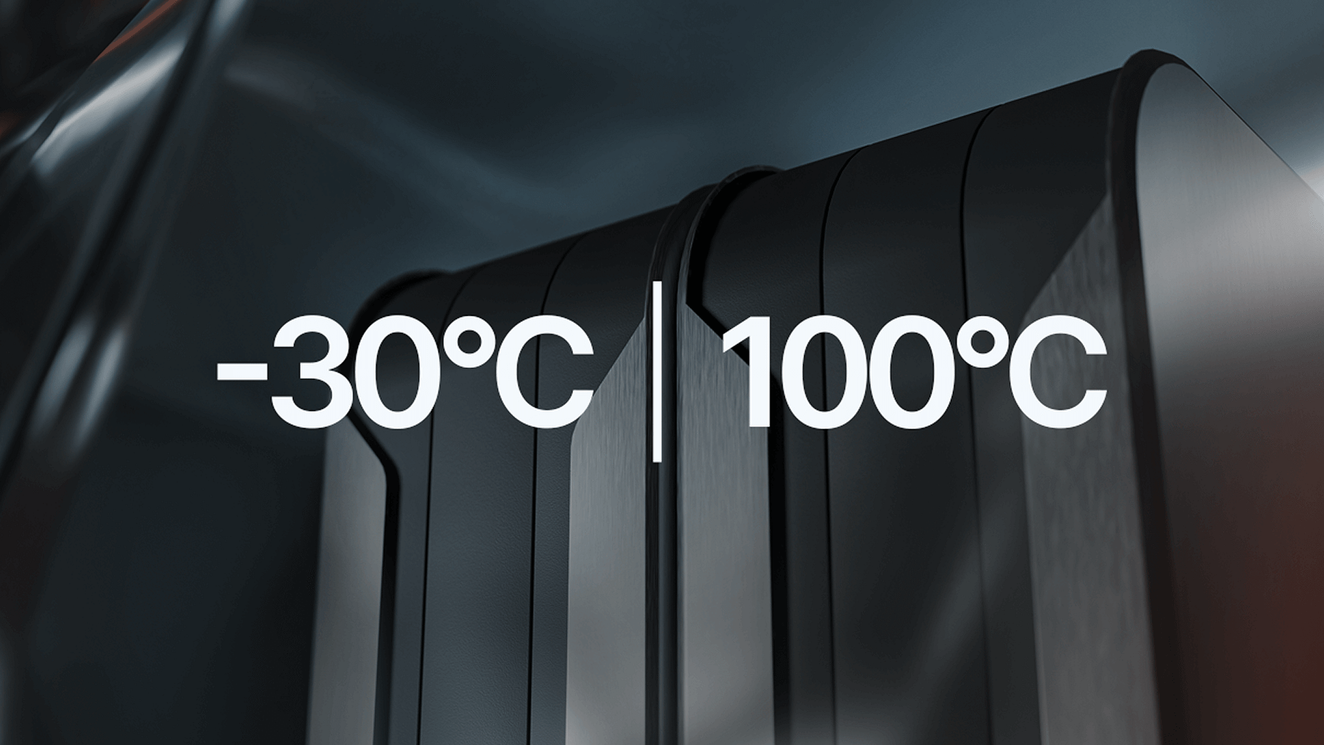 Close-up of a dark, metallic surface with the text “-30°C | 100°C” in bold white font, indicating a temperature range. The background is sleek and futuristic with a slightly blurred effect.