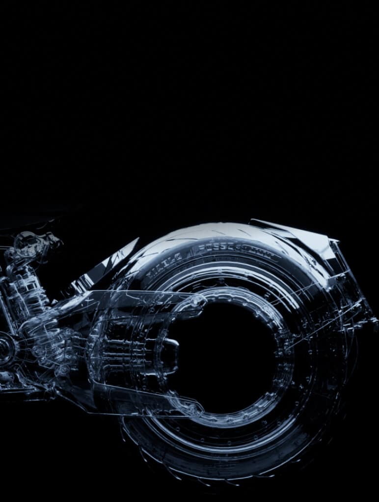 A transparent, futuristic motorcycle design is displayed against a black background, showcasing intricate details and sleek structural elements with a focus on the rear wheel and frame.