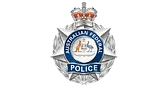 Australian Federal Police badge featuring a crown, a kangaroo and emu with a shield, and the words “Australian Federal Police” on a star-shaped silver emblem.