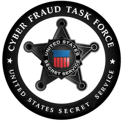 Circular black and silver emblem with a star in the center, labeled “Cyber Fraud Task Force” and “United States Secret Service” with a red, white, and blue shield in the middle.