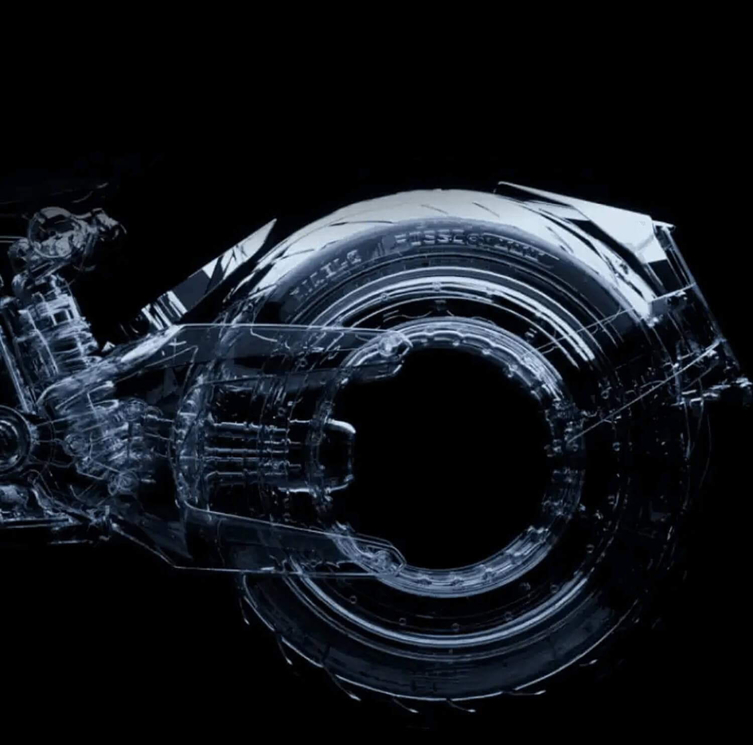 A transparent, futuristic motorcycle wheel and rear suspension are shown against a black background, highlighting the mechanical details and circular design.