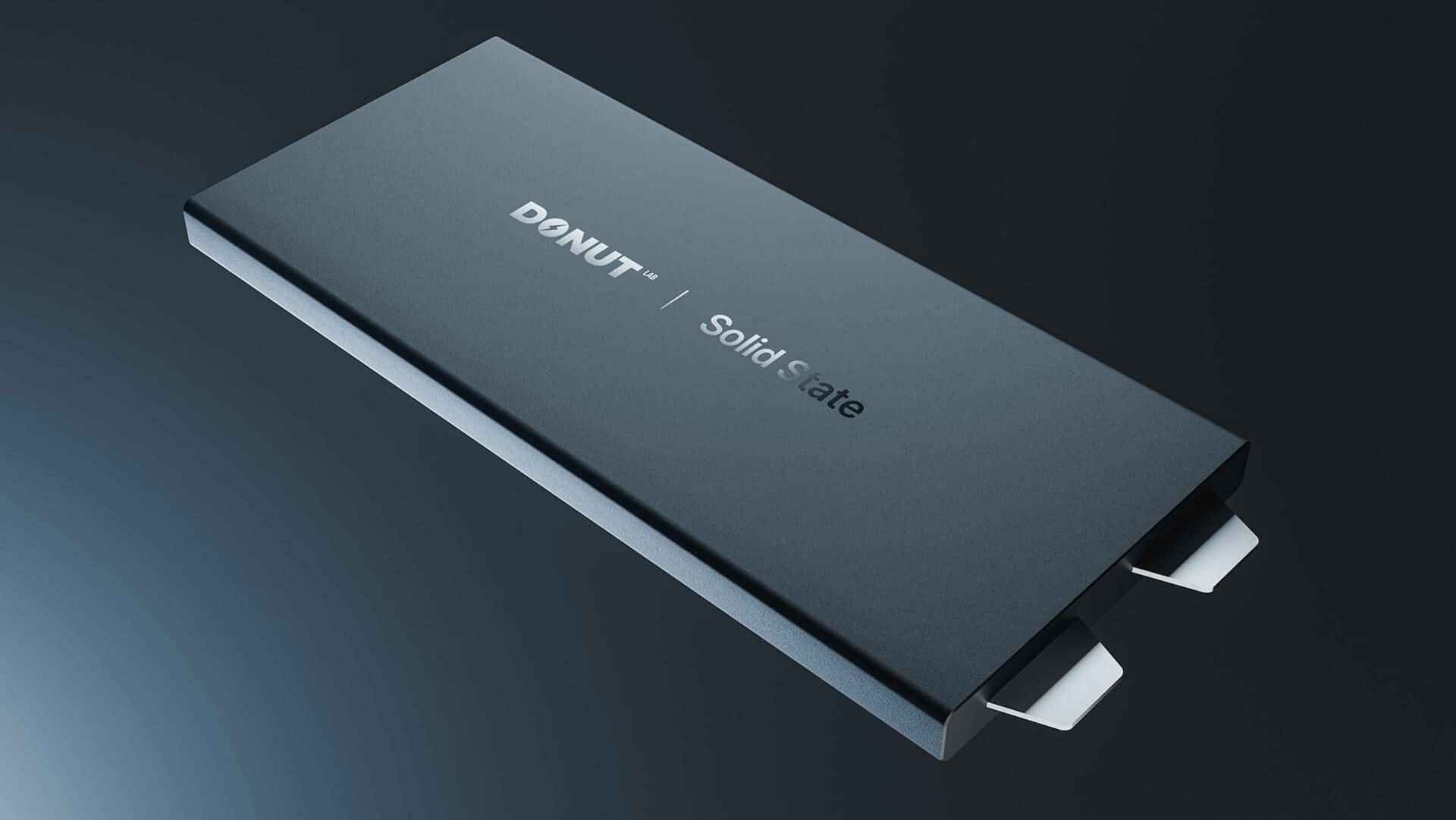 A sleek, rectangular external solid state drive labeled "DONUT | Solid State" in white text, shown on a dark gradient background with two visible connector tabs on one end.