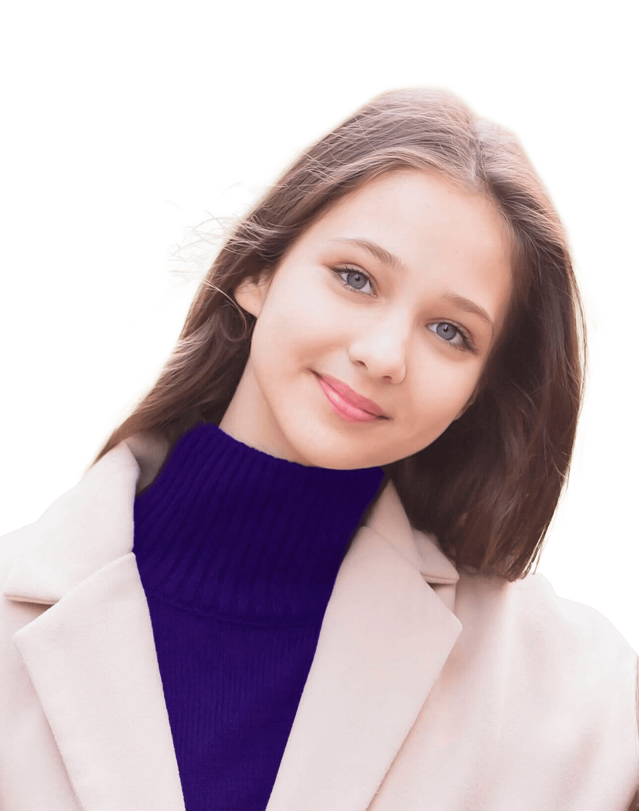 Kristina A young woman with long brown hair and blue eyes smiles slightly, wearing a cream coat over a dark blue turtleneck sweater, standing outdoors with a blurred green background.