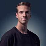 Lauri Laukkanen Donut Lab portrait A young man with short, light brown hair and light facial hair wearing a black crew-neck shirt, posing against a gradient dark blue background.