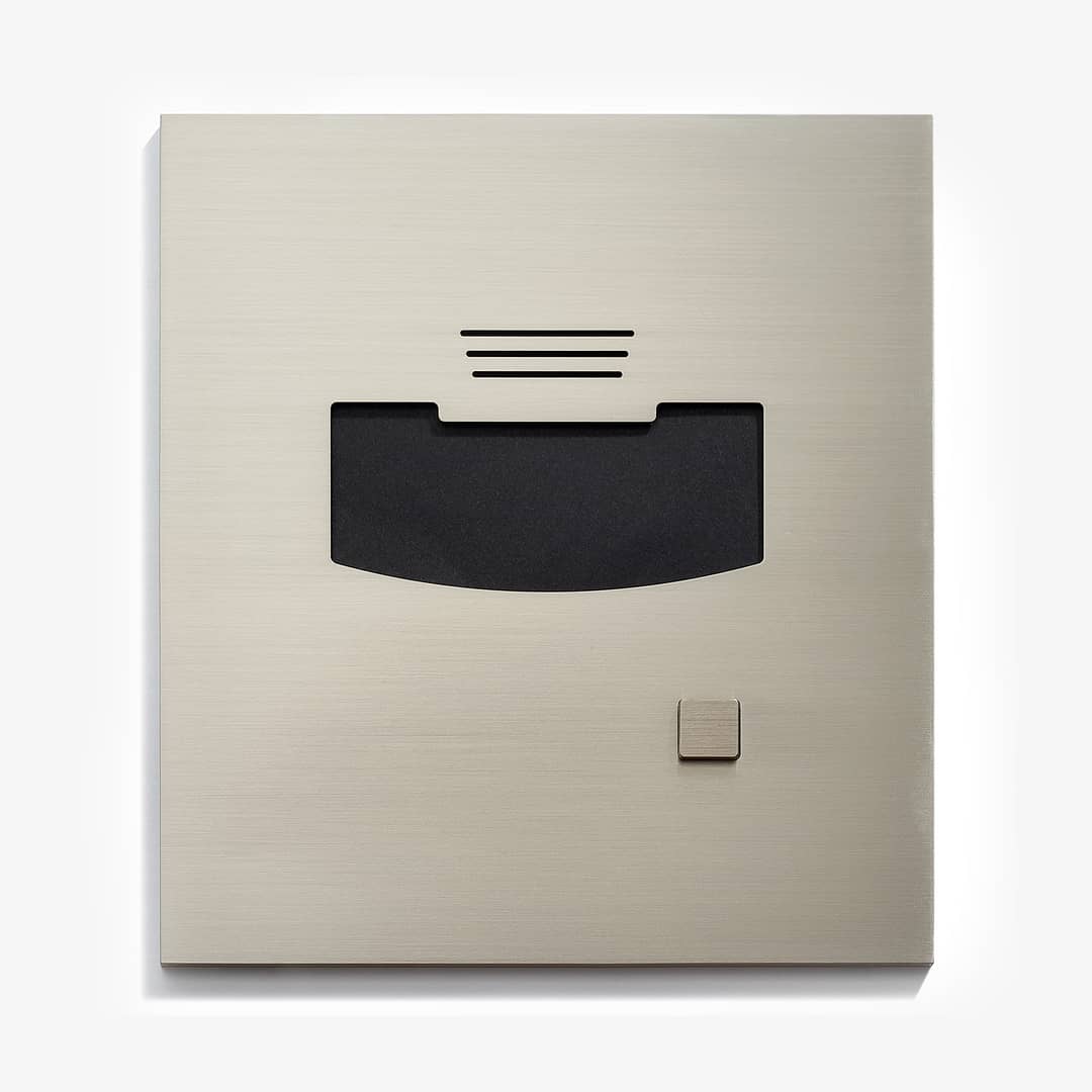 A close-up of a modern, silver-colored diskette drive with a black disk slot and a small eject button, isolated on a white background.