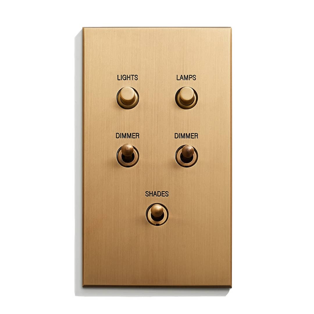 A light switch with four buttons on a white background.
