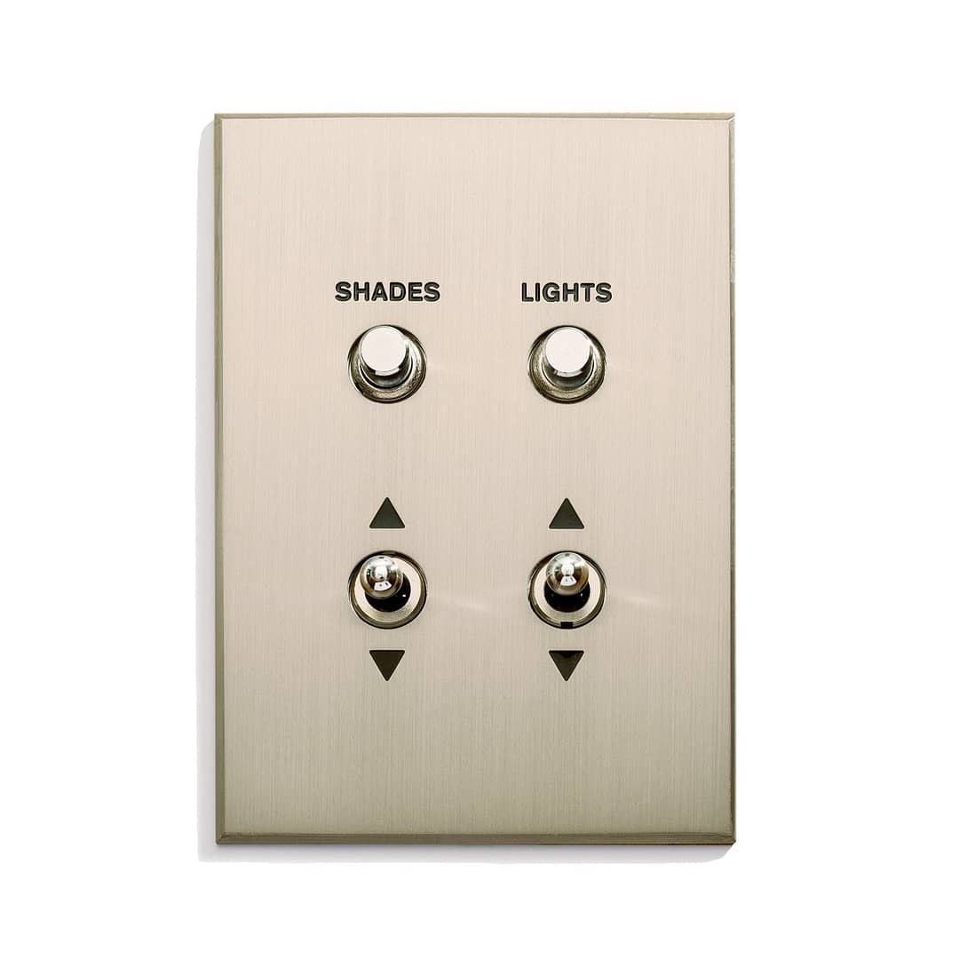 A light switch with two switches on it.