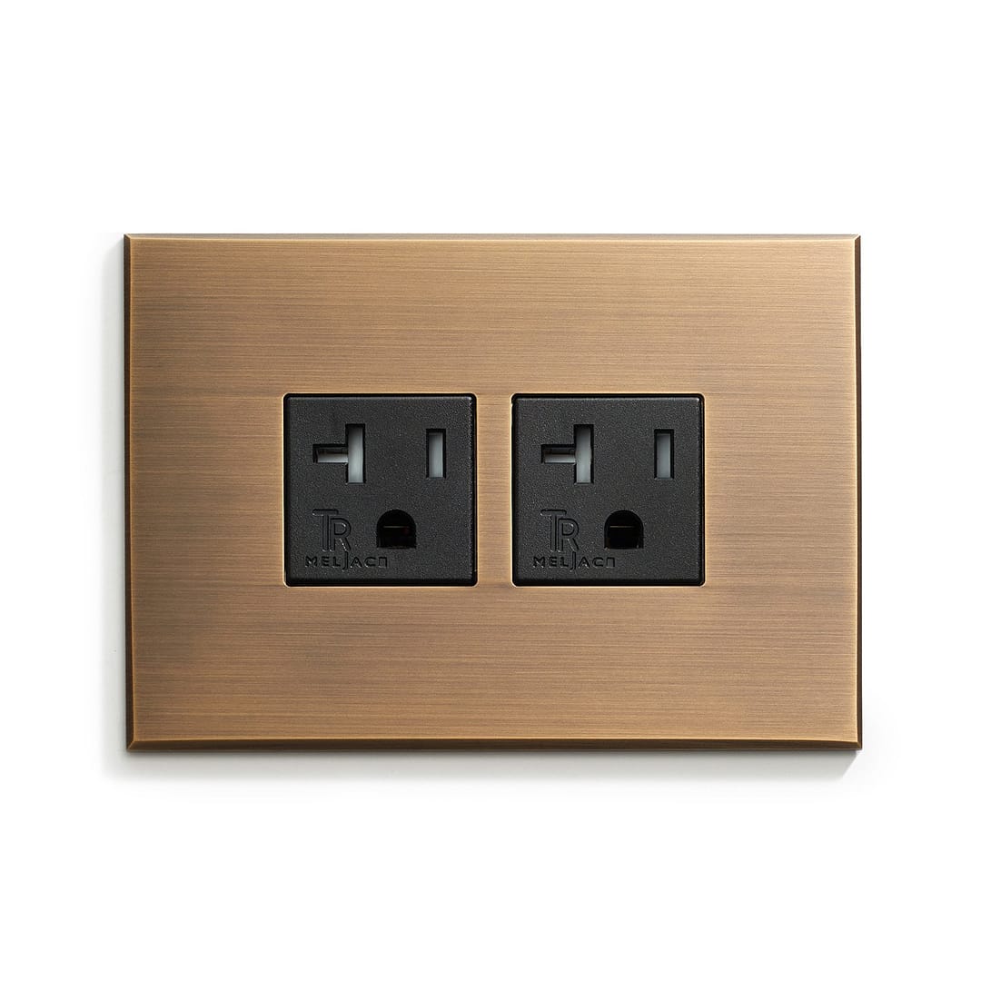 A wall plate with two outlets on it.