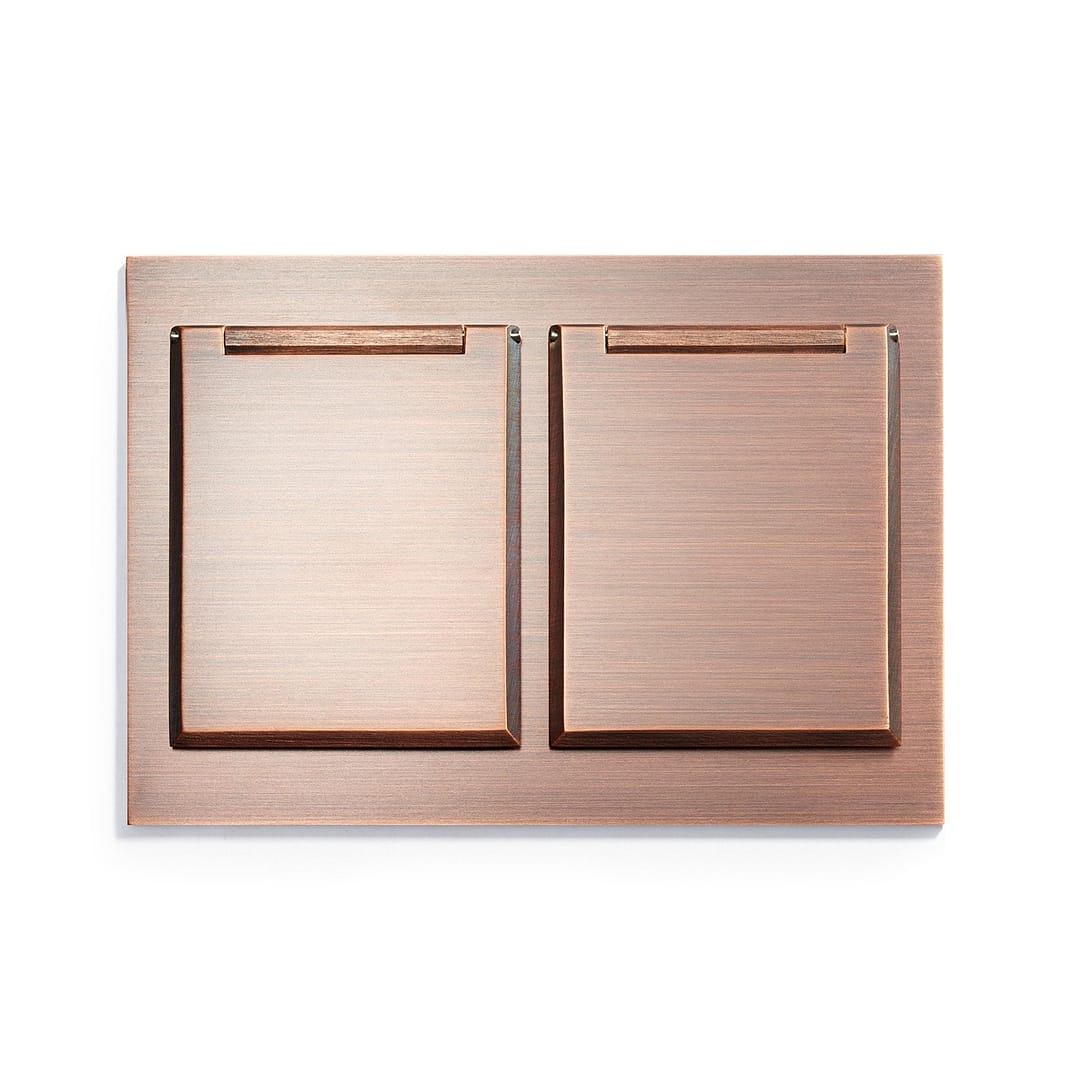 A copper plate with two compartments on it.