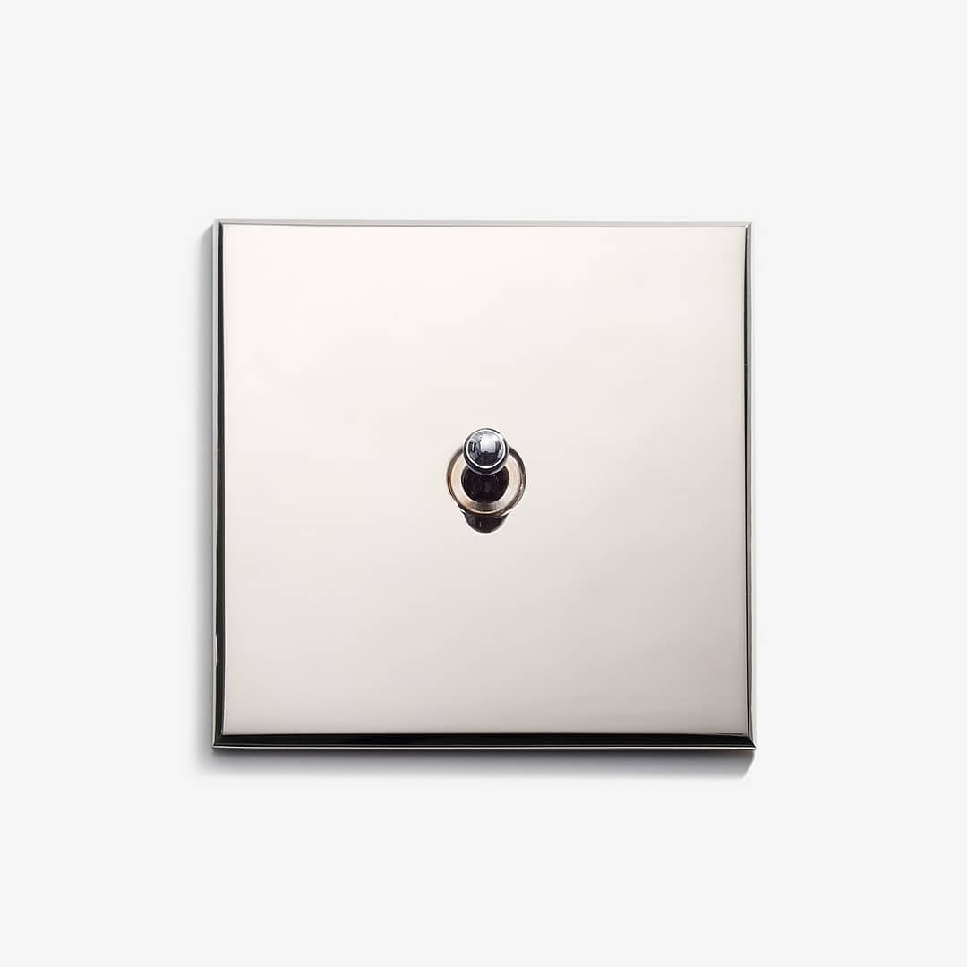 A square light switch on a white background.