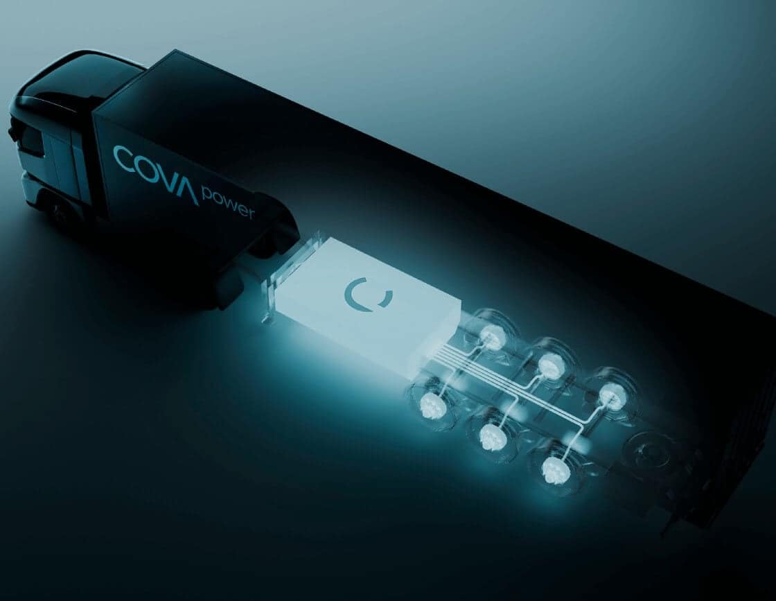 A dark, stylized illustration of a truck labeled "COVA power" with its trailer revealing blue-lit technical components and circuitry, symbolizing advanced or electrified vehicle technology.