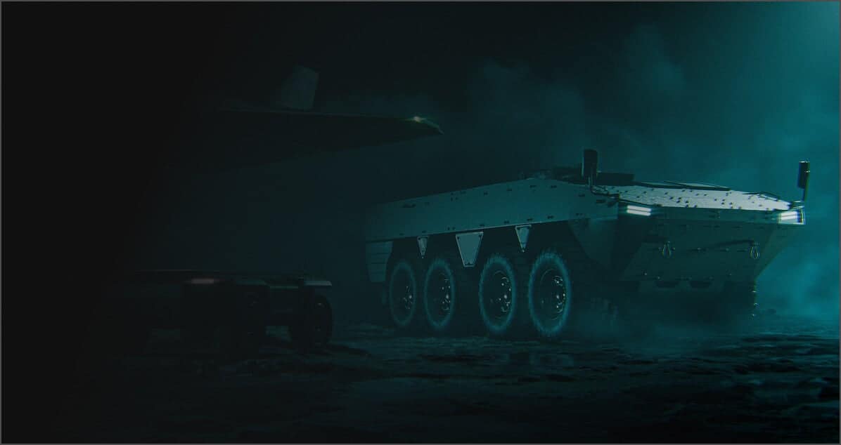 A futuristic, armored military vehicle with six wheels is illuminated by teal light, driving through a smoky, dark environment. Another vehicle is partially visible on the left side, obscured by shadow.
