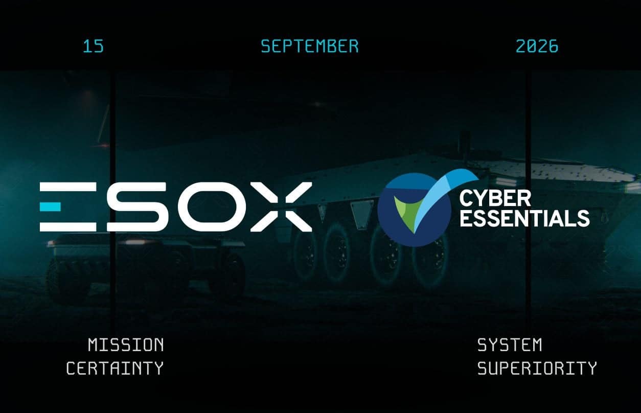 Armored vehicle in dark setting with “ESOX,” “CYBER ESSENTIALS,” and a blue-green shield logo; text reads “15 SEPTEMBER 2026,” “MISSION CERTAINTY,” and “SYSTEM SUPERIORITY.”.