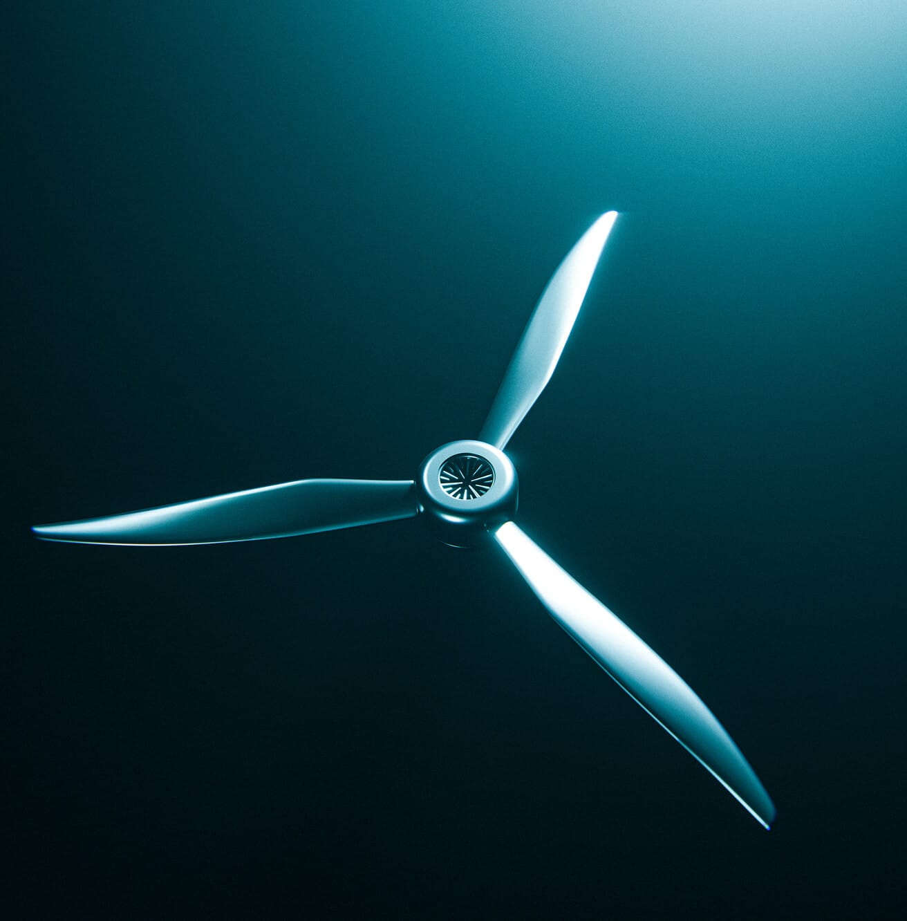 A close-up view of a three-blade propeller, lit by blue light against a dark background, creating a modern and sleek appearance.