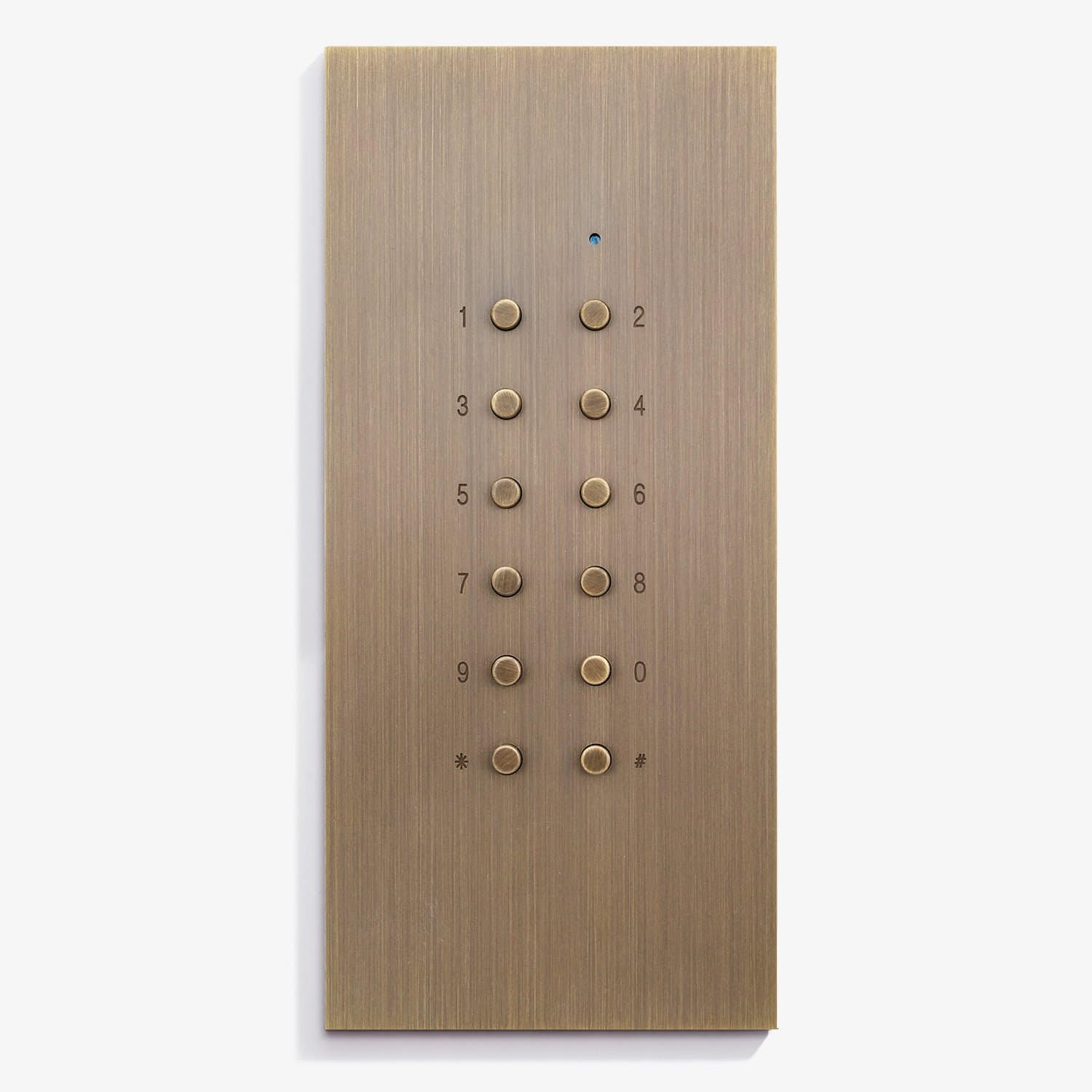 Gold-colored elevator panel with buttons from 0 to 9, star, and pound sign, with the number 2 button illuminated.