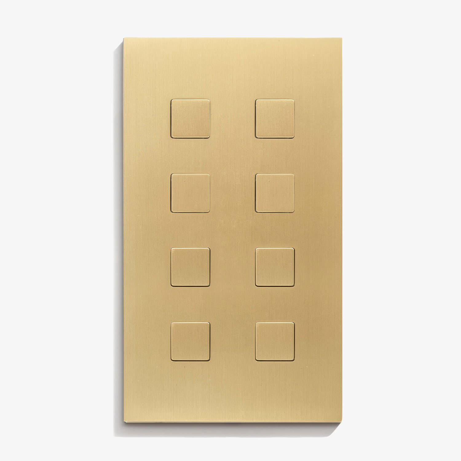 A brass plate with four squares on it.