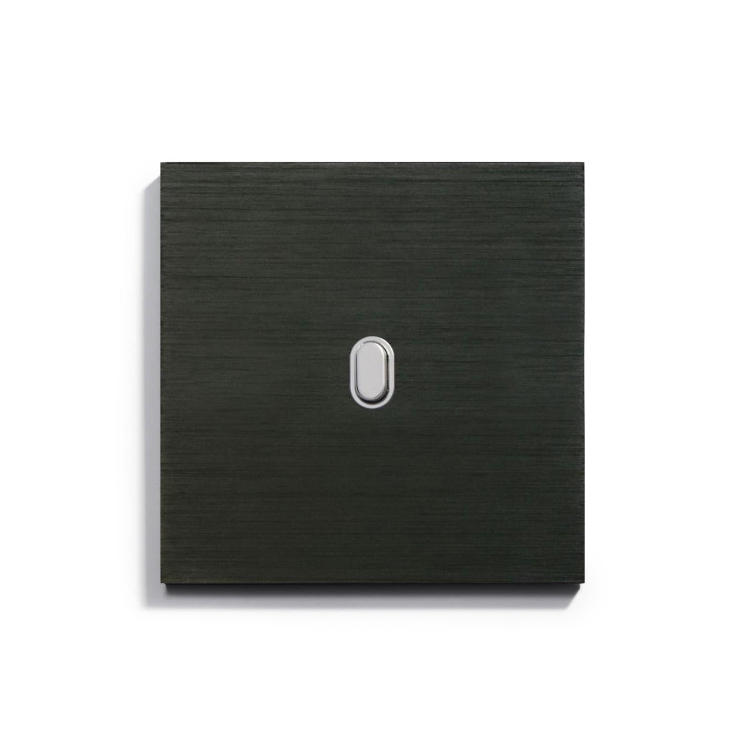 A black light switch on a white surface.