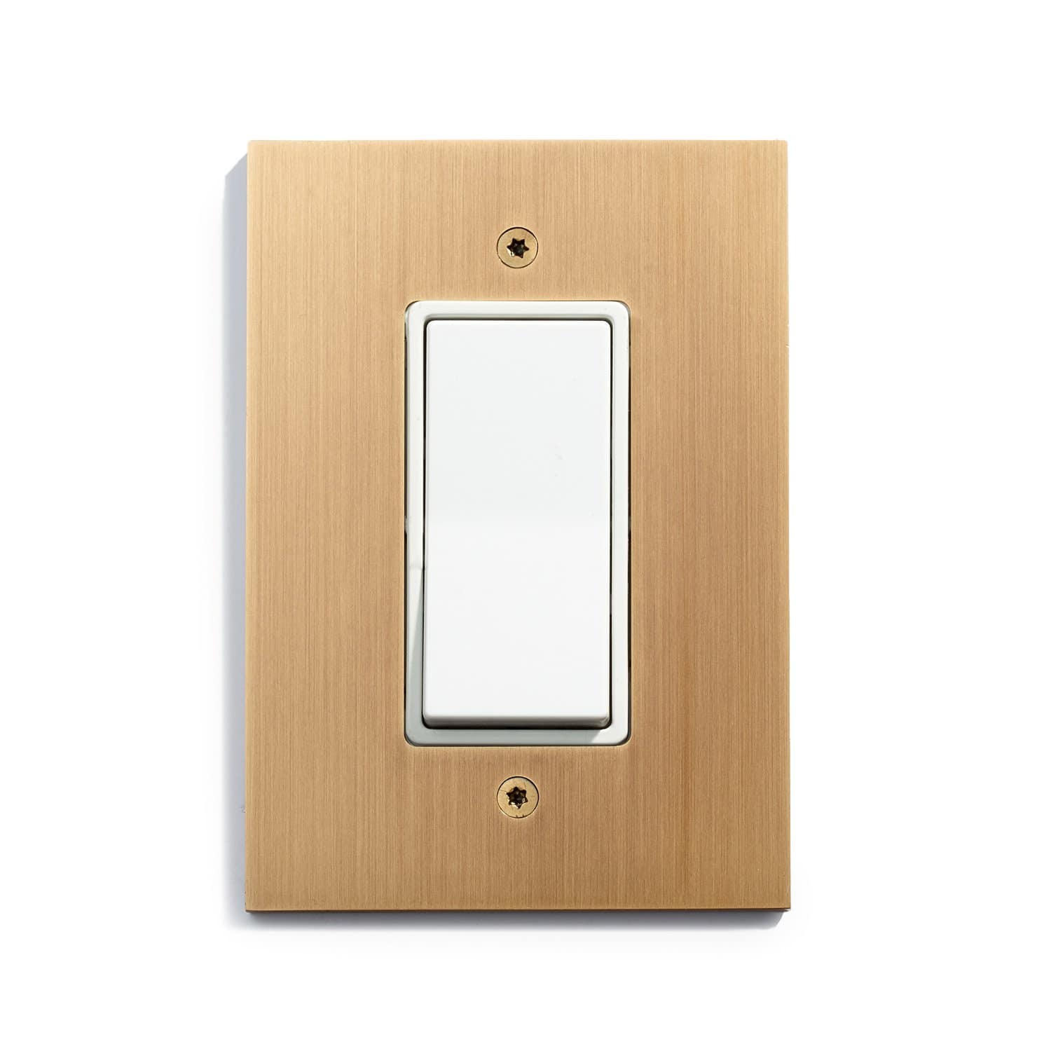 A modern light switch with a white toggle on a wooden panel, isolated on a white background.