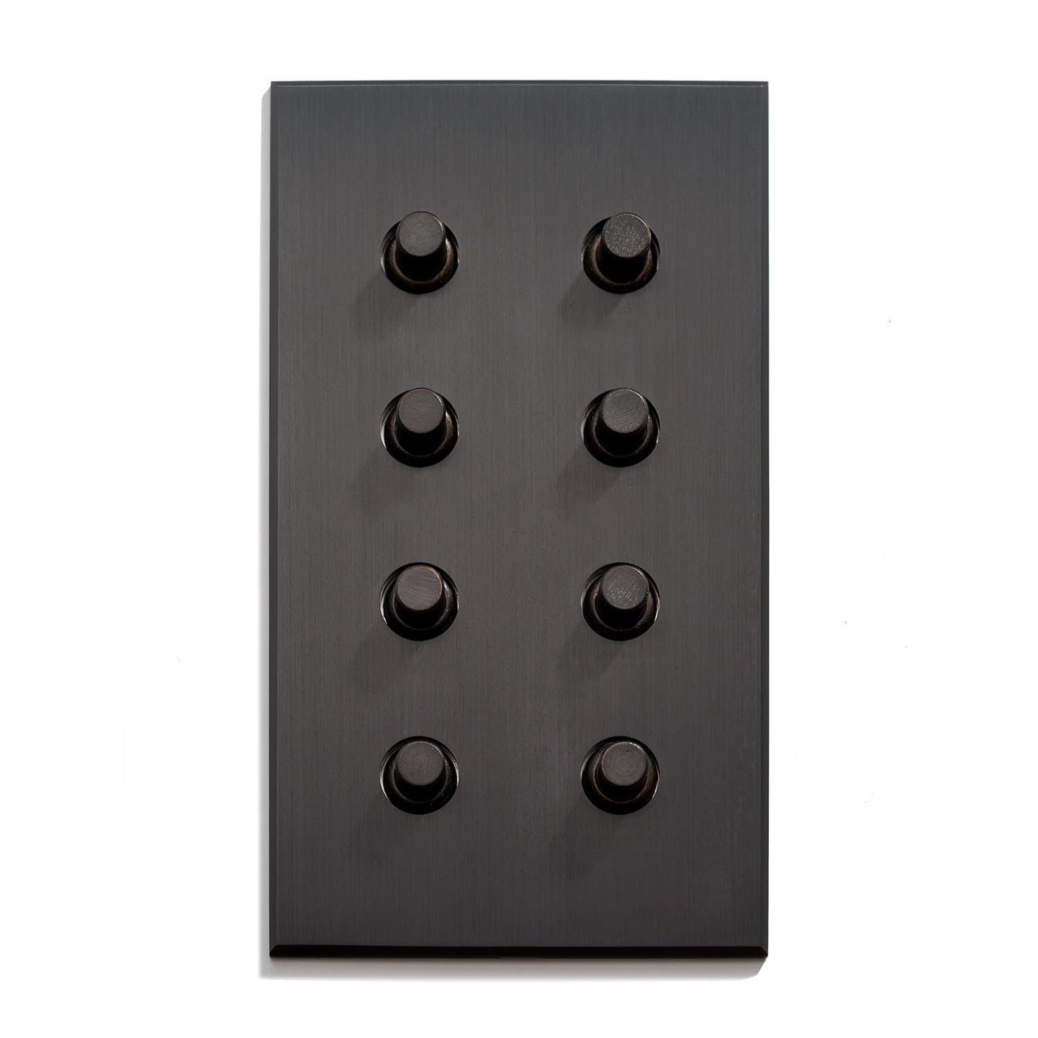 Black panel with an array of nine knobs against a white background.