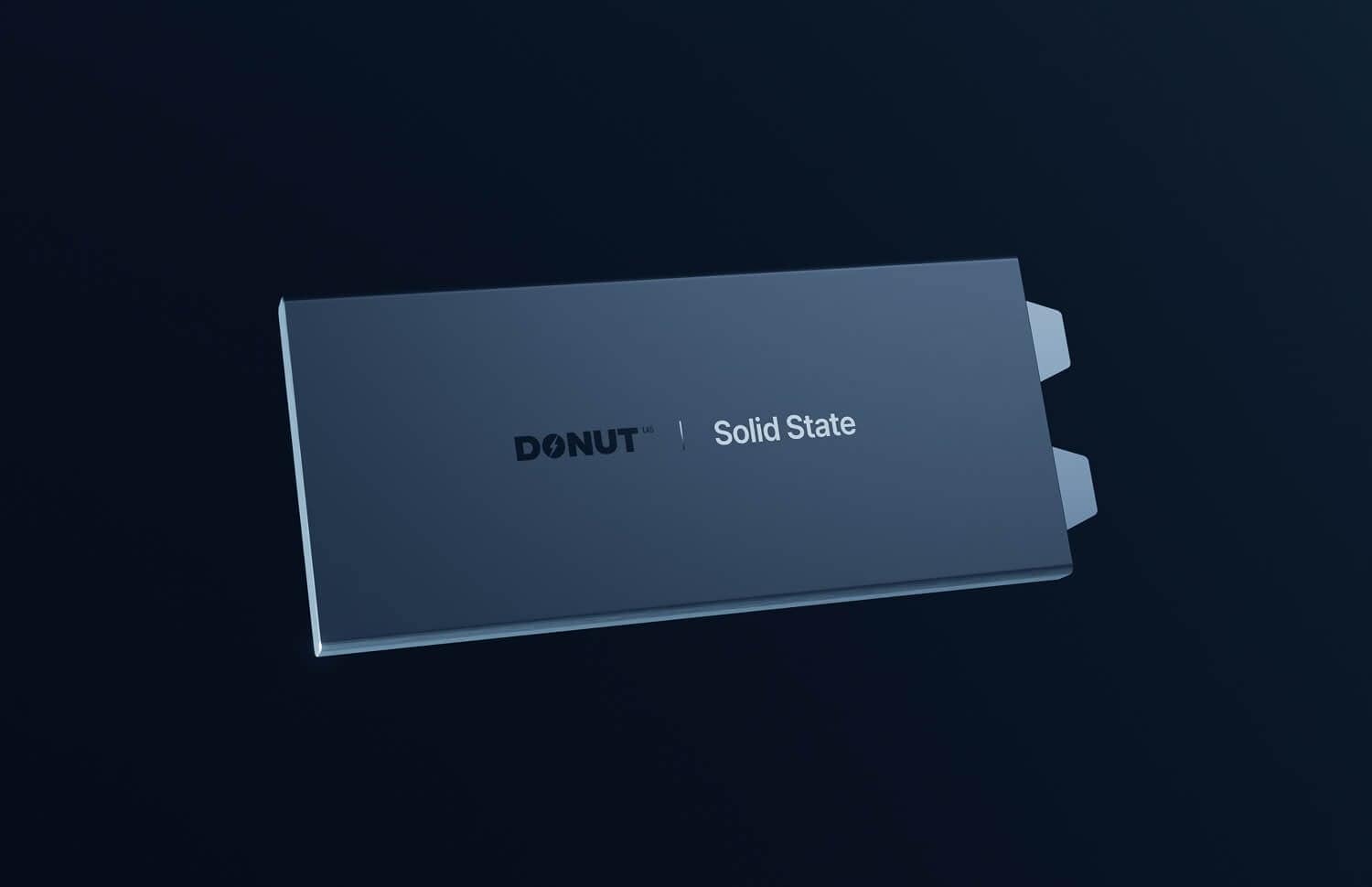 A sleek, dark gray solid state drive labeled "DONUT Solid State" with two small tabs on one side, displayed against a dark blue background.
