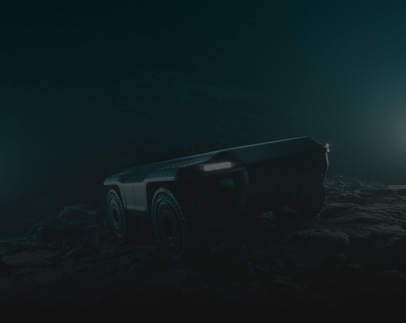 A dark, moody image of a rugged, autonomous vehicle with large tires driving over rocky terrain, illuminated by faint light in a shadowy environment.
