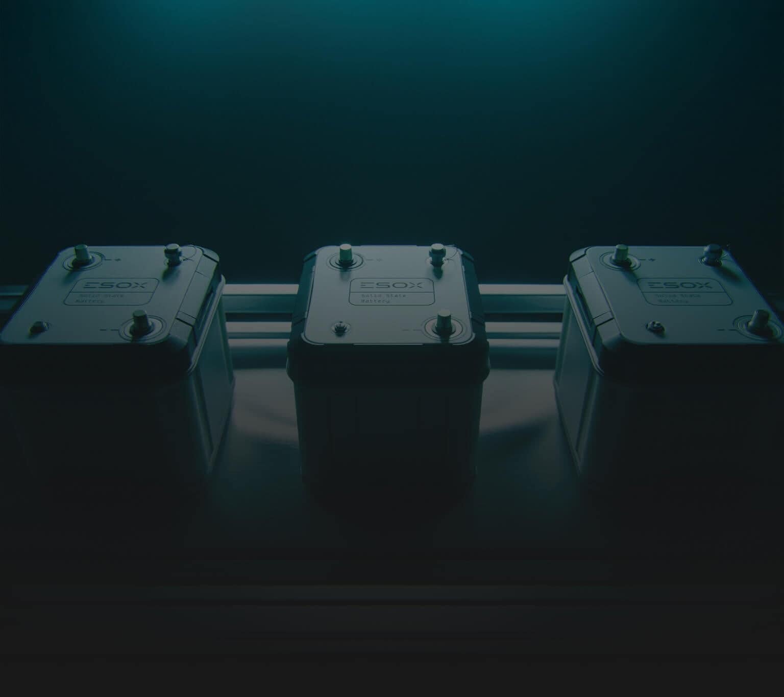 Three rectangular battery cells with labeled tops are arranged side by side on a metallic surface, illuminated by a blue-tinted light from above, creating a dramatic, industrial atmosphere.