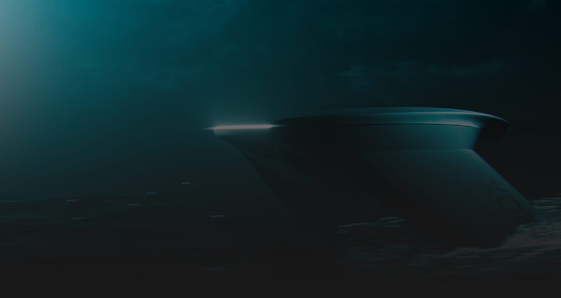 A large, modern ship with a sleek, curved bow is illuminated by a faint light, cutting through dark, misty waters under a cloudy night sky.
