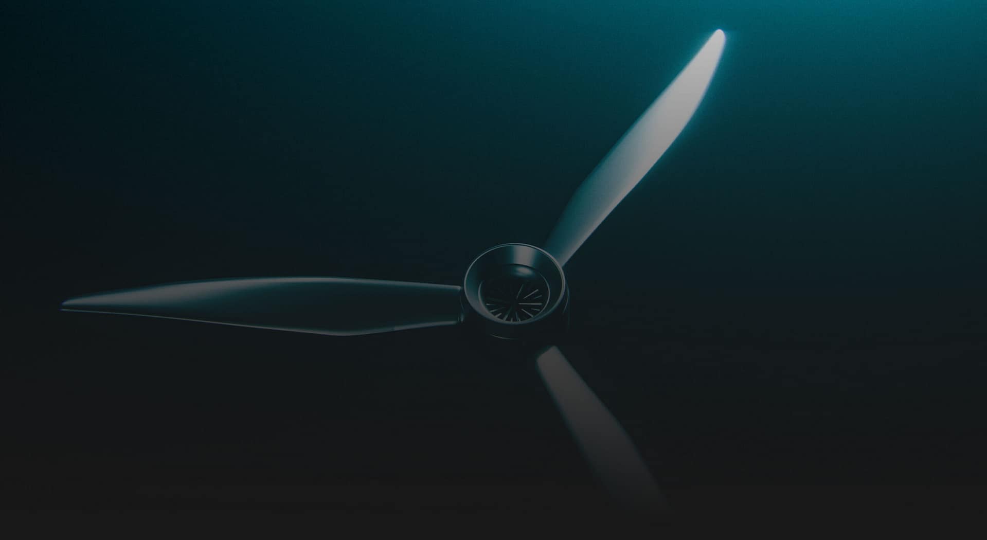 A close-up, top-down view of a three-bladed propeller with light shining on it, set against a dark background.