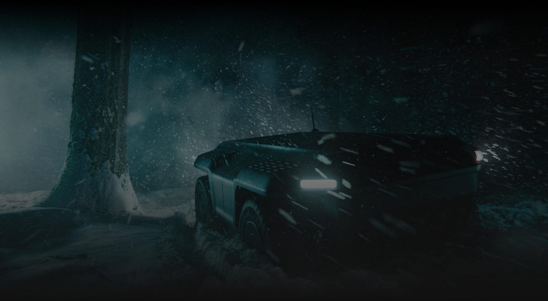 A futuristic, angular vehicle with bright headlights drives through a snowy forest at night, with snow falling heavily and a tall tree visible on the left.