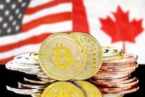 bitcoins on american and Canada flag background