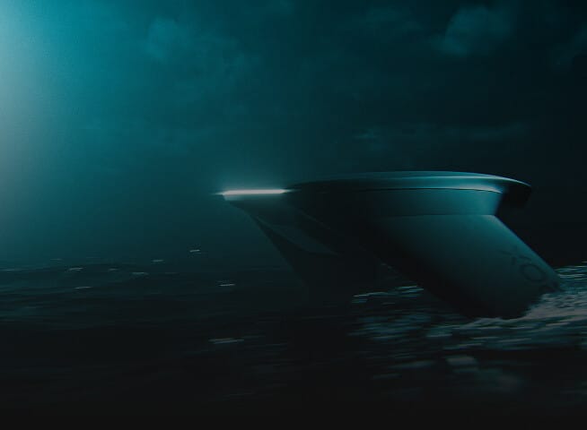 A sleek, futuristic boat with illuminated edges glides through dark, misty water at night, creating ripples under a cloudy sky.