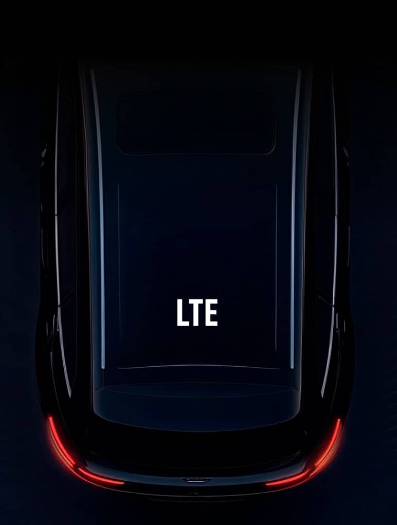 A sleek, glossy car roof with the letters 