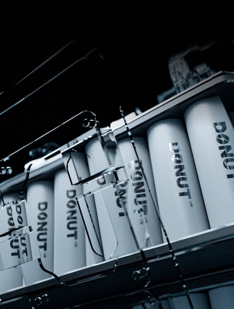 A row of cylindrical products labeled 